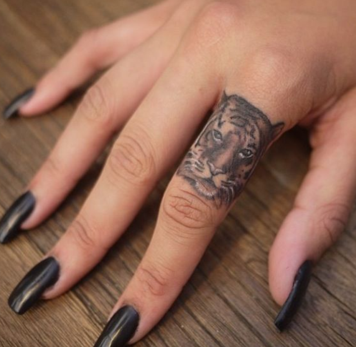 Grey Ink Tiger Head Finger Tattoo