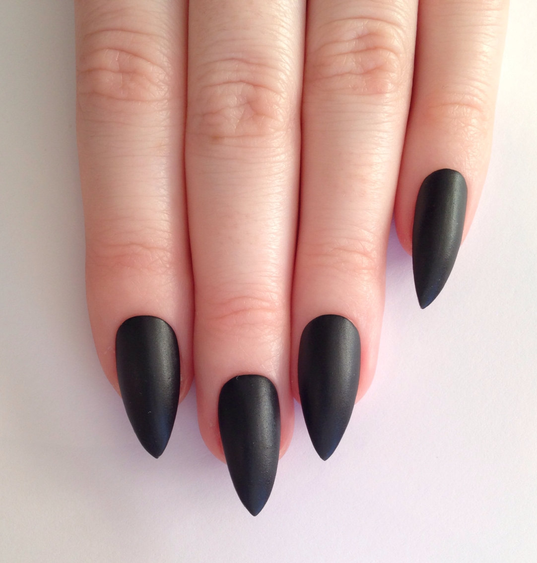 Matte black stiletto nails