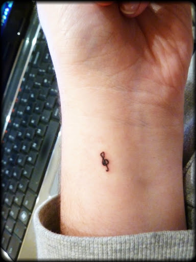 small music note symbol tattoo