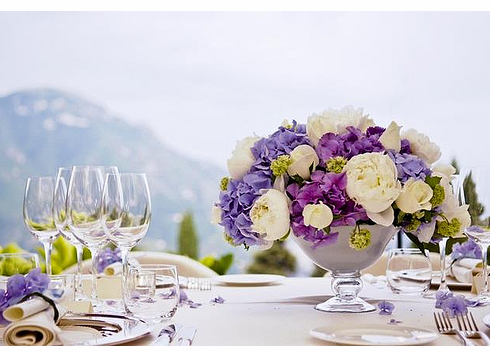 Summer wedding centerpiece with blue and purple flowers